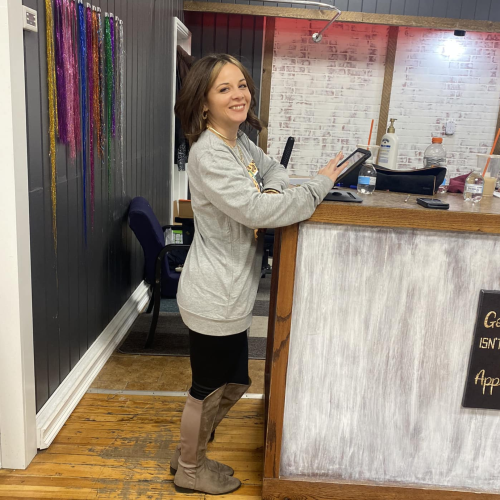 Melinda at reception desk